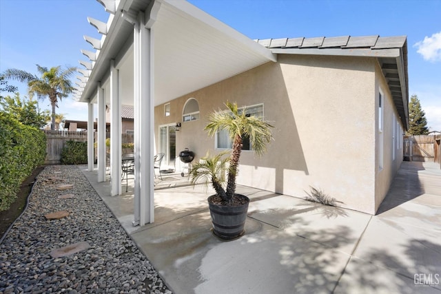 rear view of house featuring a patio area