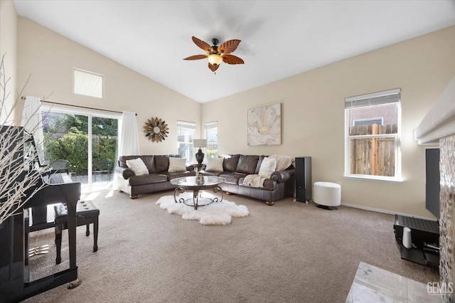 carpeted living room featuring high vaulted ceiling and ceiling fan