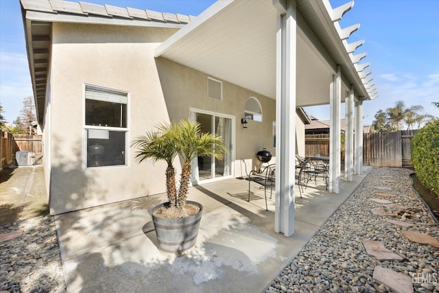 back of house with a patio