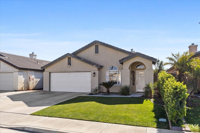 view of front facade with a garage and a front yard