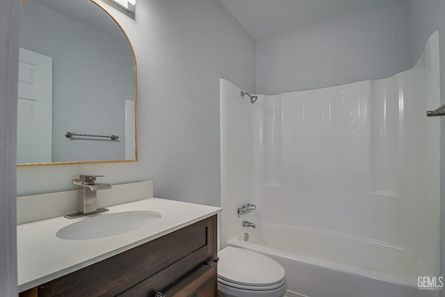 bathroom with  shower combination, vanity, and toilet