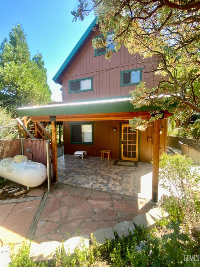 rear view of house featuring a patio area