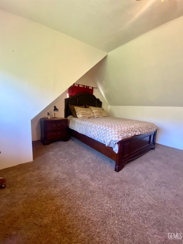 carpeted bedroom featuring vaulted ceiling