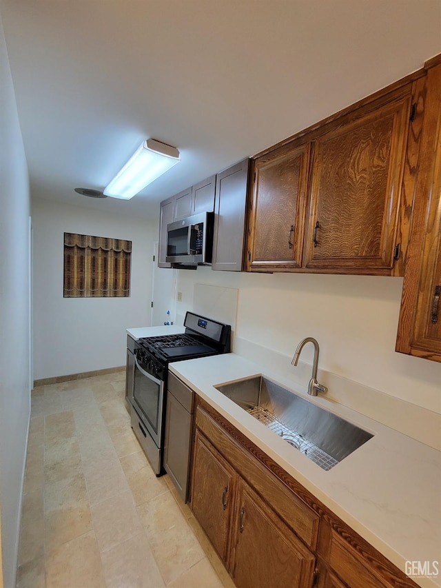 6918 Crestwood St, Bakersfield, CA 93308 - kitchen featuring appliances with stainless steel finishes and light countertops
