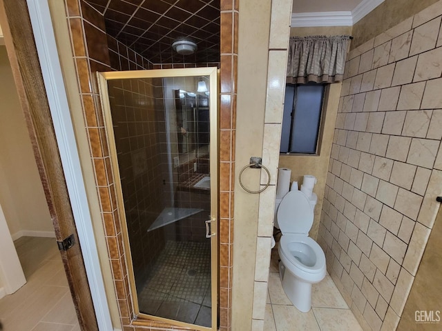 6918 Crestwood St, Bakersfield, CA 93308 - full bathroom featuring a stall shower, tile patterned floors, crown molding, and tile walls