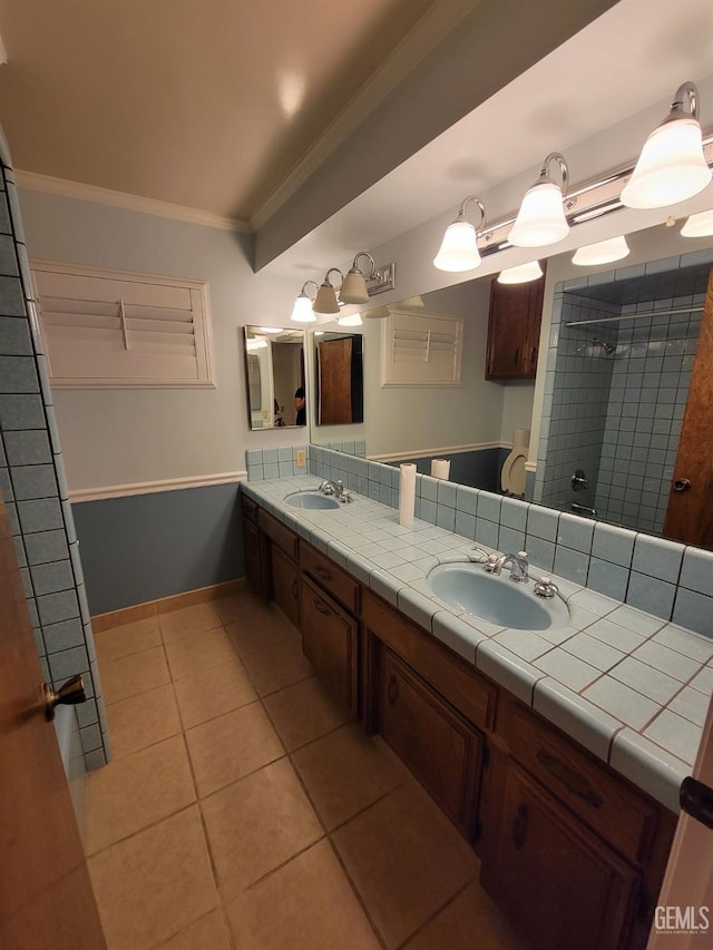 6918 Crestwood St, Bakersfield, CA 93308 - bathroom with ornamental molding, double vanity, and tile patterned flooring