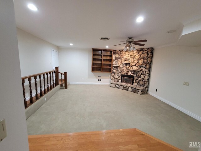 6918 Crestwood St, Bakersfield, CA 93308 - unfurnished living room with ceiling fan, recessed lighting, carpet flooring, and a fireplace