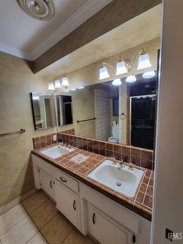 6918 Crestwood St, Bakersfield, CA 93308 - bathroom featuring crown molding, double vanity, tile patterned floors, decorative backsplash, and tiled shower