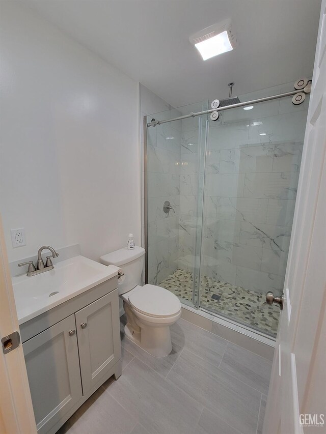 6918 Crestwood St, Bakersfield, CA 93308 - full bath featuring a marble finish shower, vanity, and tile patterned floors