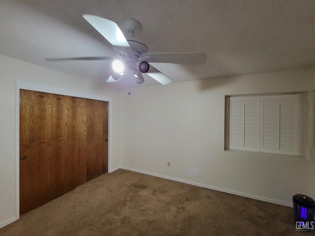 6918 Crestwood St, Bakersfield, CA 93308 - unfurnished bedroom with carpet flooring, a closet, and a ceiling fan