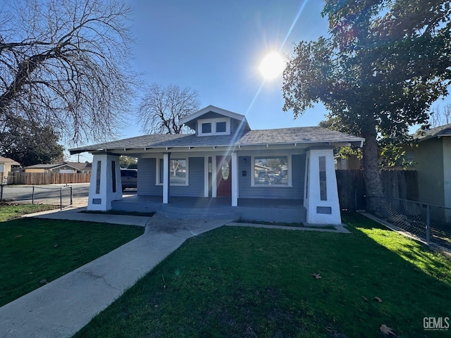 bungalow with a front yard