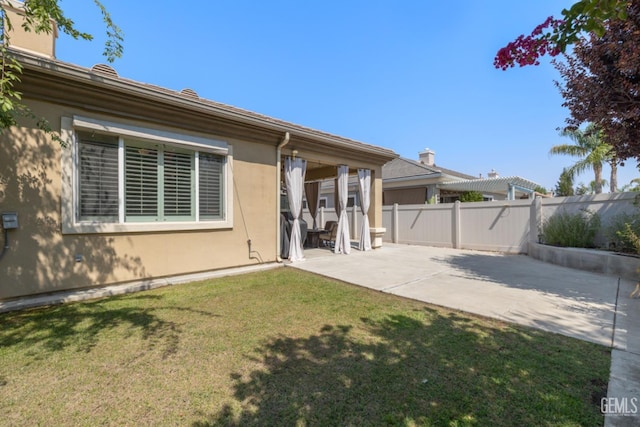 5703 Park Pl, Bakersfield, CA 93306 - back of house featuring stucco siding and a patio