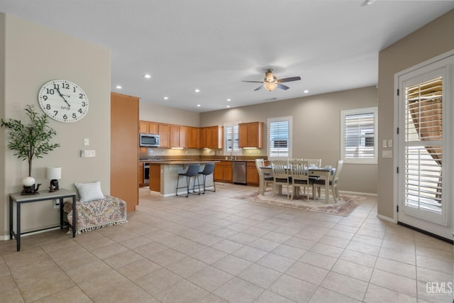 5703 Park Pl, Bakersfield, CA 93306 - dining area with ceiling fan, recessed lighting, and light tile patterned floors