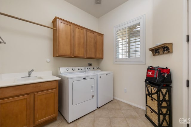 5703 Park Pl, Bakersfield, CA 93306 - washroom with cabinet space, washing machine and clothes dryer, and light tile patterned flooring