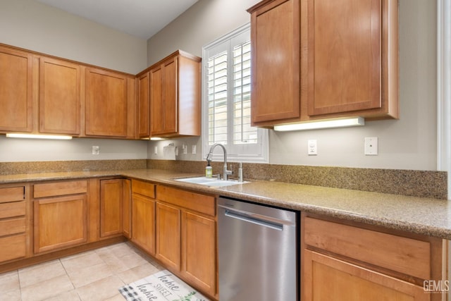 5703 Park Pl, Bakersfield, CA 93306 - kitchen featuring stainless steel dishwasher, light tile patterned floors, and brown cabinetry