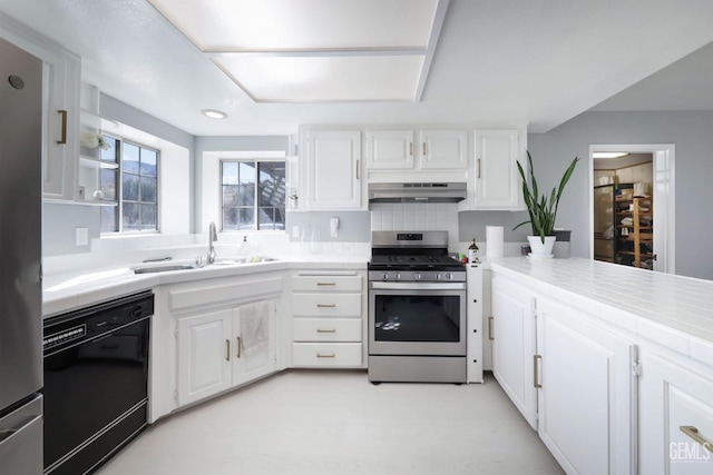 kitchen featuring backsplash, appliances with stainless steel finishes, sink, and white cabinets