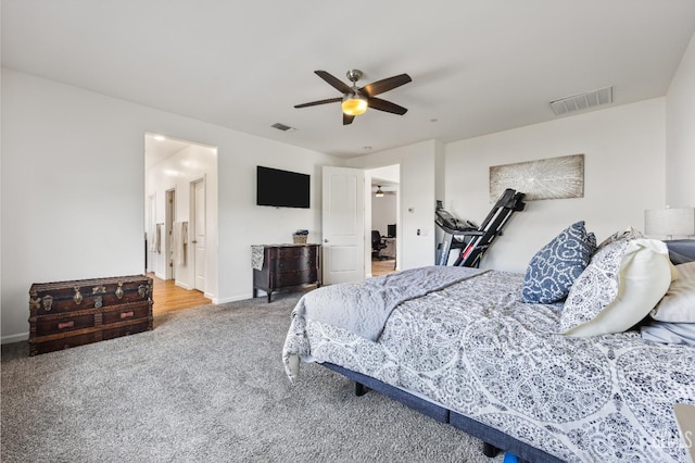 carpeted bedroom featuring visible vents, a ceiling fan, and baseboards