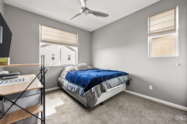 bedroom with light carpet, ceiling fan, and baseboards