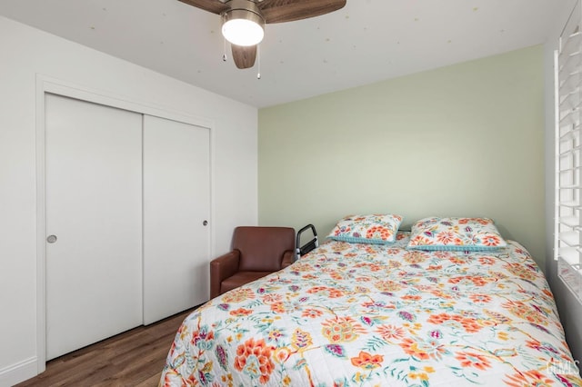 bedroom featuring a ceiling fan, a closet, and wood finished floors