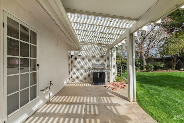 view of patio / terrace featuring fence, a grill, and a pergola