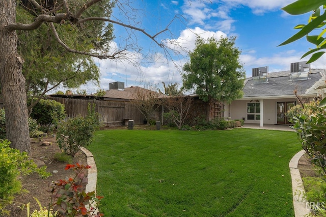 view of yard featuring fence and a patio