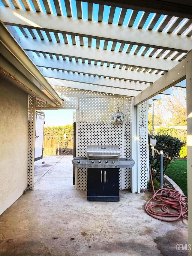 view of patio with a pergola and grilling area