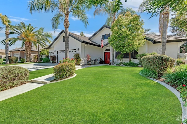 11915 Fessler Ln, Bakersfield, CA 93311 - view of front of property with stucco siding, an attached garage, driveway, and a front yard