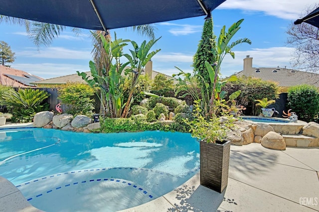11915 Fessler Ln, Bakersfield, CA 93311 - outdoor pool with a fenced backyard and an in ground hot tub