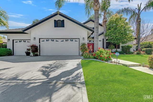 11915 Fessler Ln, Bakersfield, CA 93311 - view of front facade with a tile roof, a garage, concrete driveway, a front yard, and stucco siding