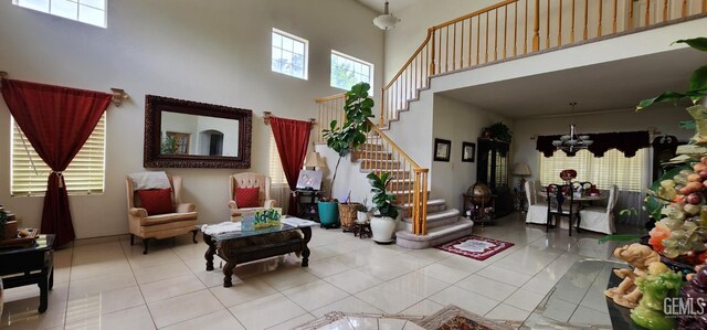 2013 Calle, Los Camichines, Bakersfield, CA 93309 - tiled living area featuring a high ceiling, a chandelier, and stairs