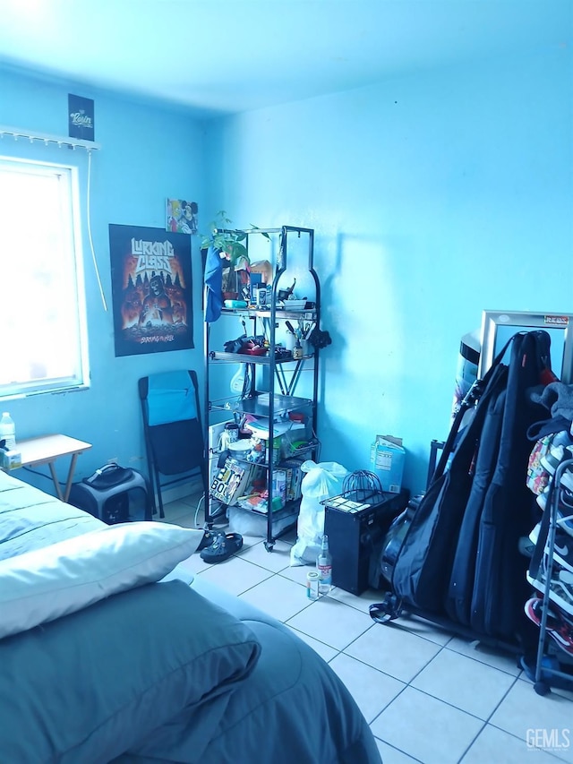 bedroom with light tile patterned floors