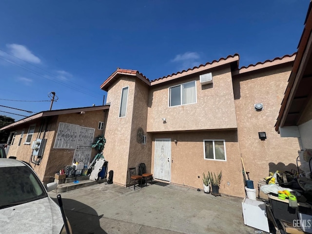 rear view of property with a patio