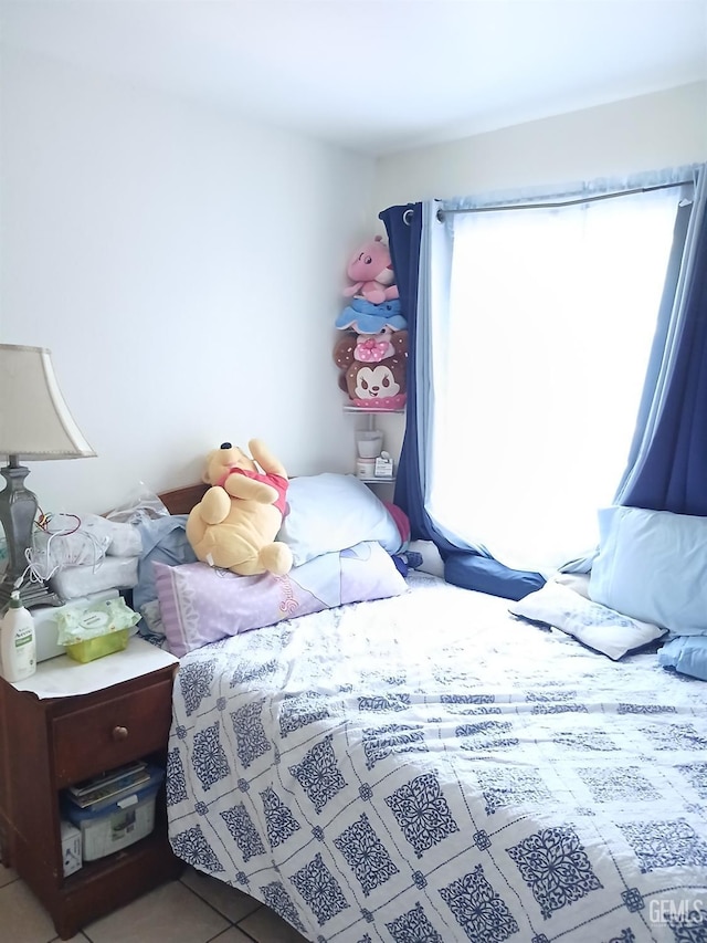 bedroom with tile patterned floors