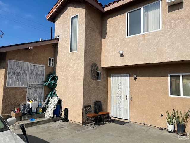 back of property featuring a patio area