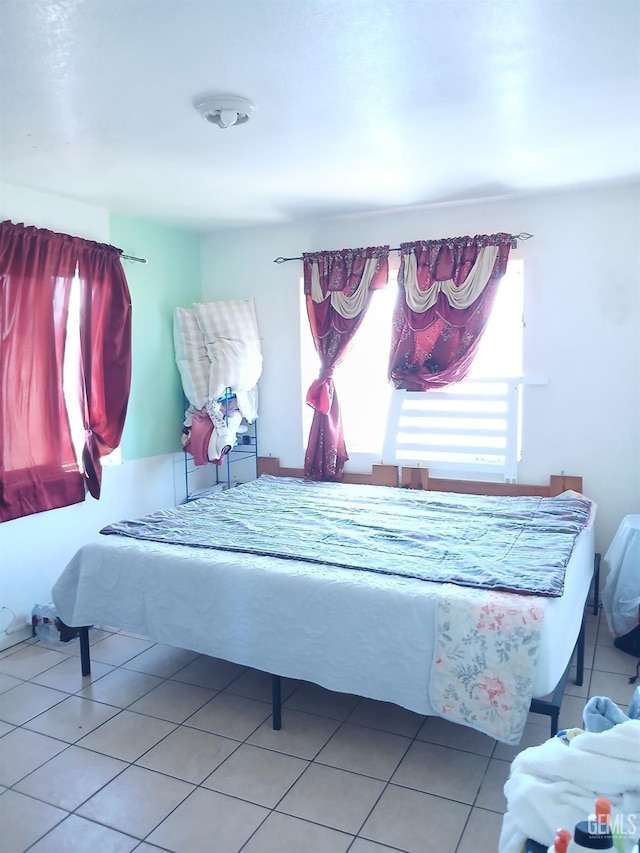 bedroom with light tile patterned flooring