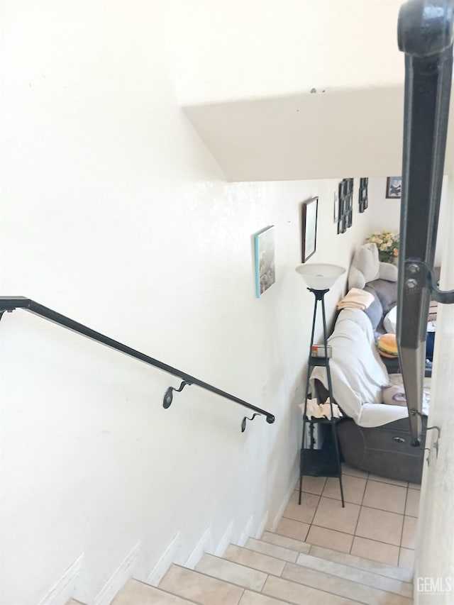 stairs with tile patterned floors