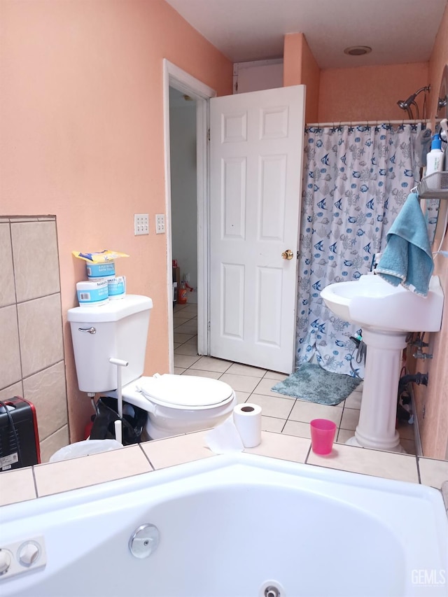 bathroom with tile patterned flooring, toilet, and walk in shower