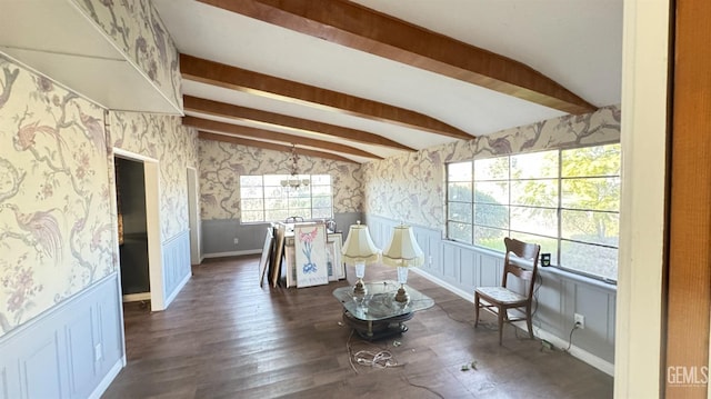 living area featuring lofted ceiling with beams and dark wood-type flooring