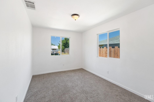 438 Cedar Ave, Earlimart, CA 93219 - carpeted empty room with healthy amount of natural light and baseboards