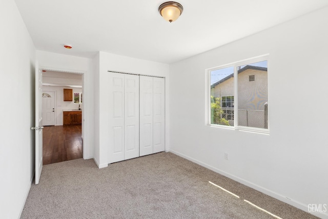 438 Cedar Ave, Earlimart, CA 93219 - unfurnished bedroom with a closet, carpet flooring, and baseboards