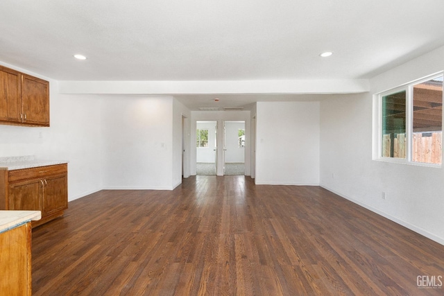 438 Cedar Ave, Earlimart, CA 93219 - unfurnished living room featuring dark wood finished floors, recessed lighting, and baseboards