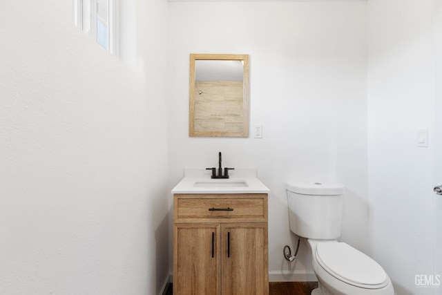 438 Cedar Ave, Earlimart, CA 93219 - bathroom with toilet, vanity, and baseboards