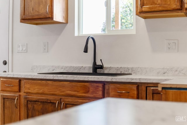 438 Cedar Ave, Earlimart, CA 93219 - kitchen featuring a sink and brown cabinetry