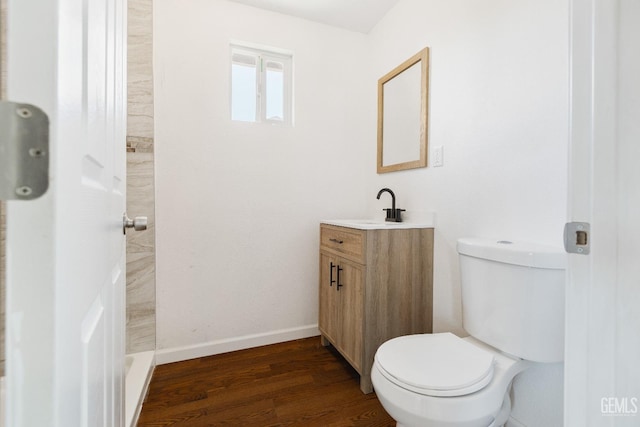 438 Cedar Ave, Earlimart, CA 93219 - bathroom with wood finished floors, vanity, toilet, and baseboards