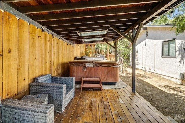 wooden terrace with a hot tub