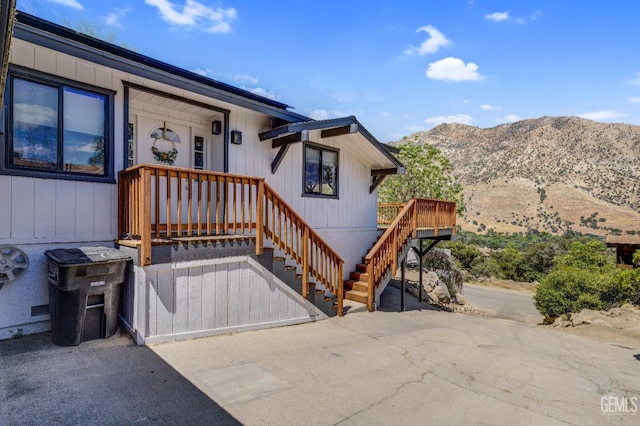 view of exterior entry featuring a mountain view