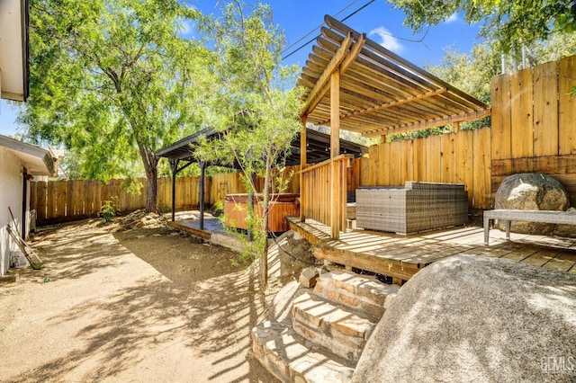 view of patio with a pergola, an outdoor living space, and a hot tub