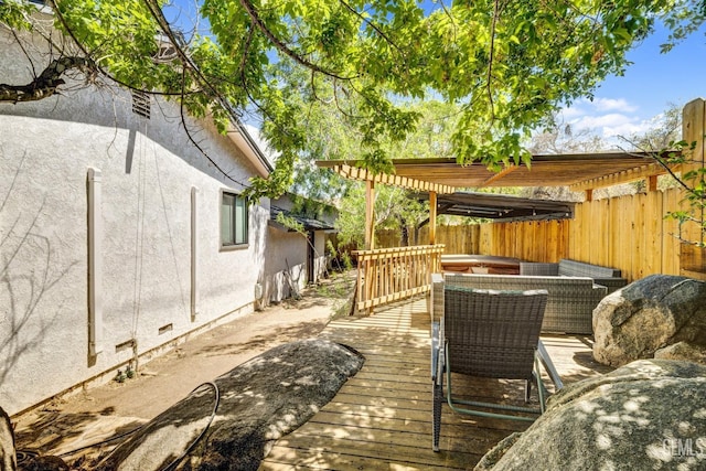 wooden terrace with a pergola and a jacuzzi