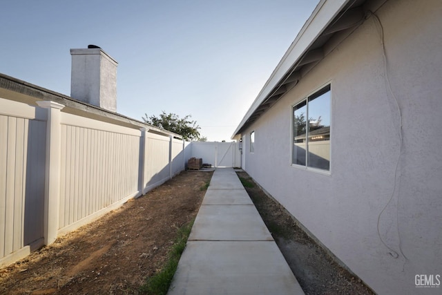 view of yard featuring fence and a gate