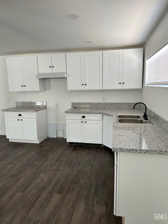 1012 Yosemite Dr, Bakersfield, CA 93308 - kitchen featuring white cabinets, light stone countertops, and dark wood-style floors